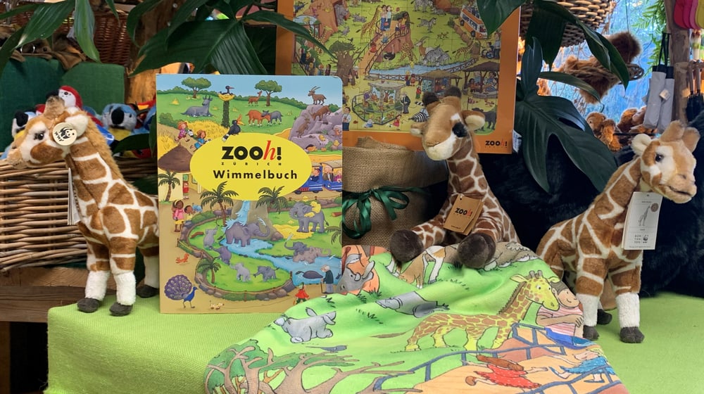 Promotionstisch mit Wimmelbildprodukten im Zooshop.